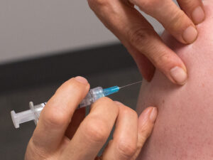 travel nurse getting flue shot during flu season